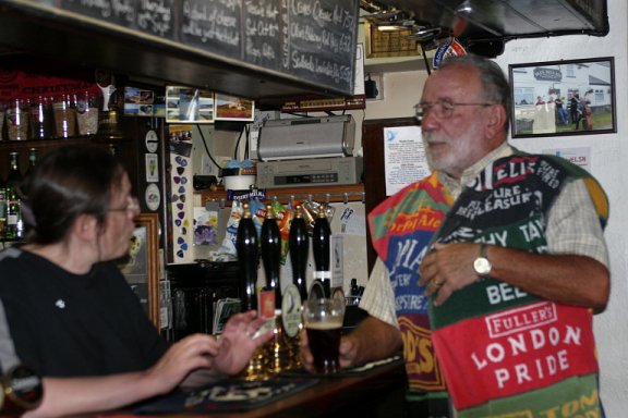 Chairman Malcolm in his coat of many bar towels.